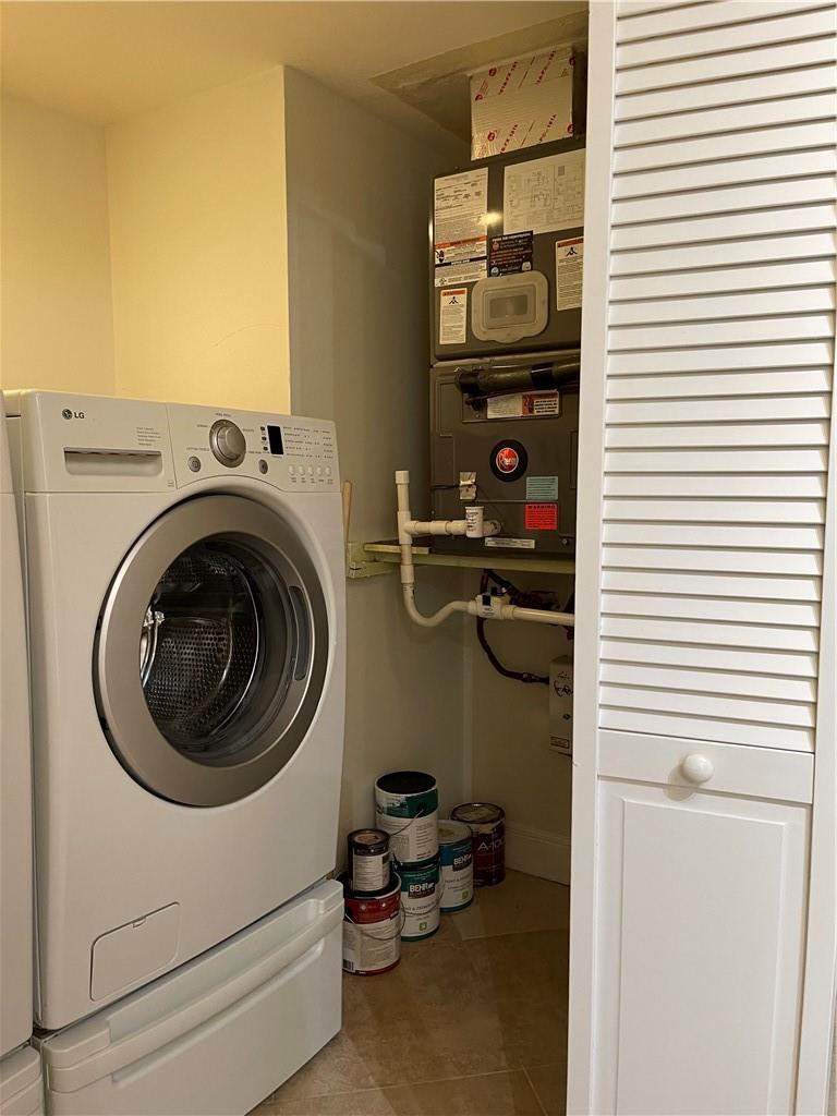 491 Racquet Club Road, Unit 109 Weston, FL 33326 - Photo 38 of 39 a utility room with dryer and washer