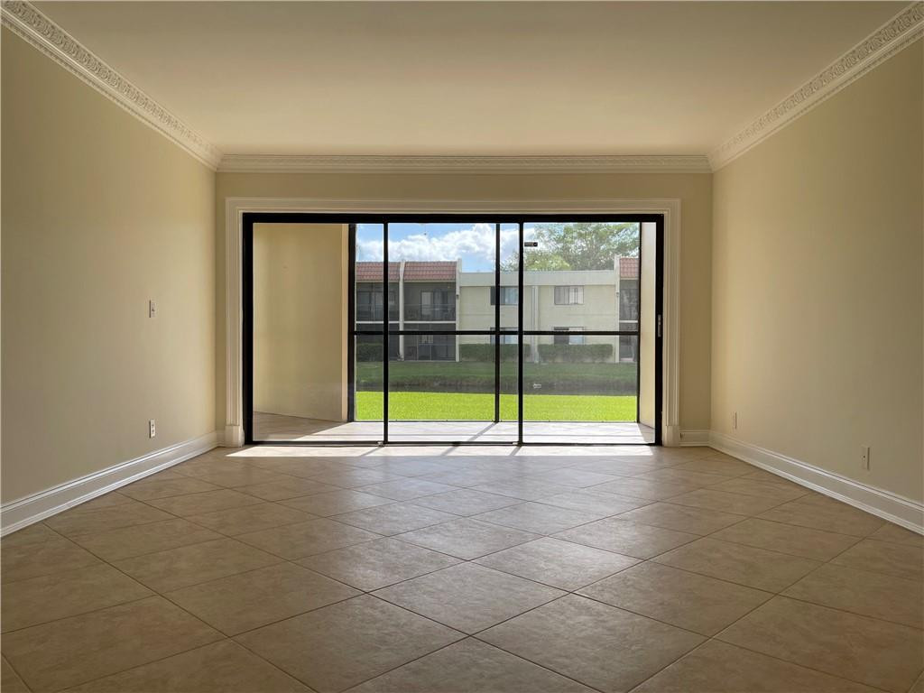 491 Racquet Club Road, Unit 109 Weston, FL 33326 - Photo 4 of 39 a view of an empty room with a window