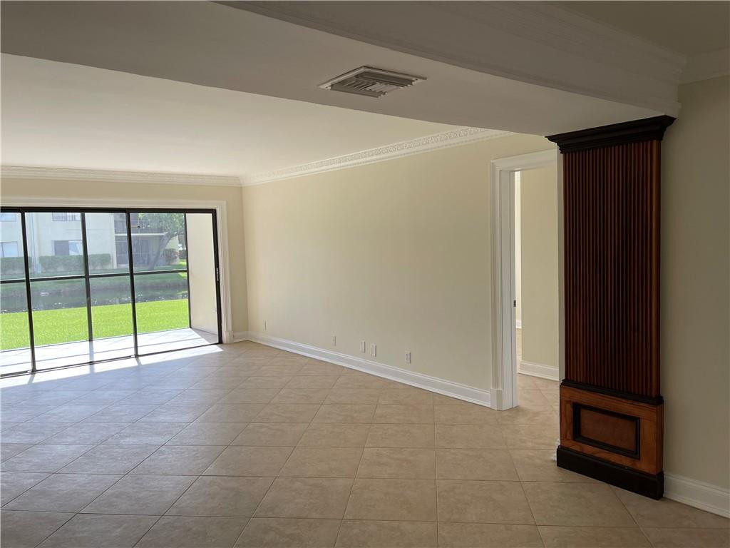 491 Racquet Club Road, Unit 109 Weston, FL 33326 - Photo 6 of 39 a view of an empty room and window