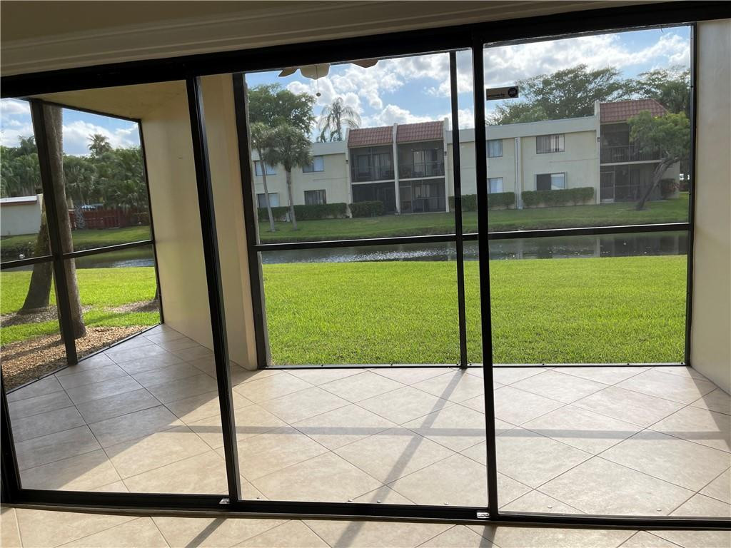 491 Racquet Club Road, Unit 109 Weston, FL 33326 - Photo 8 of 39 a view of a glass door