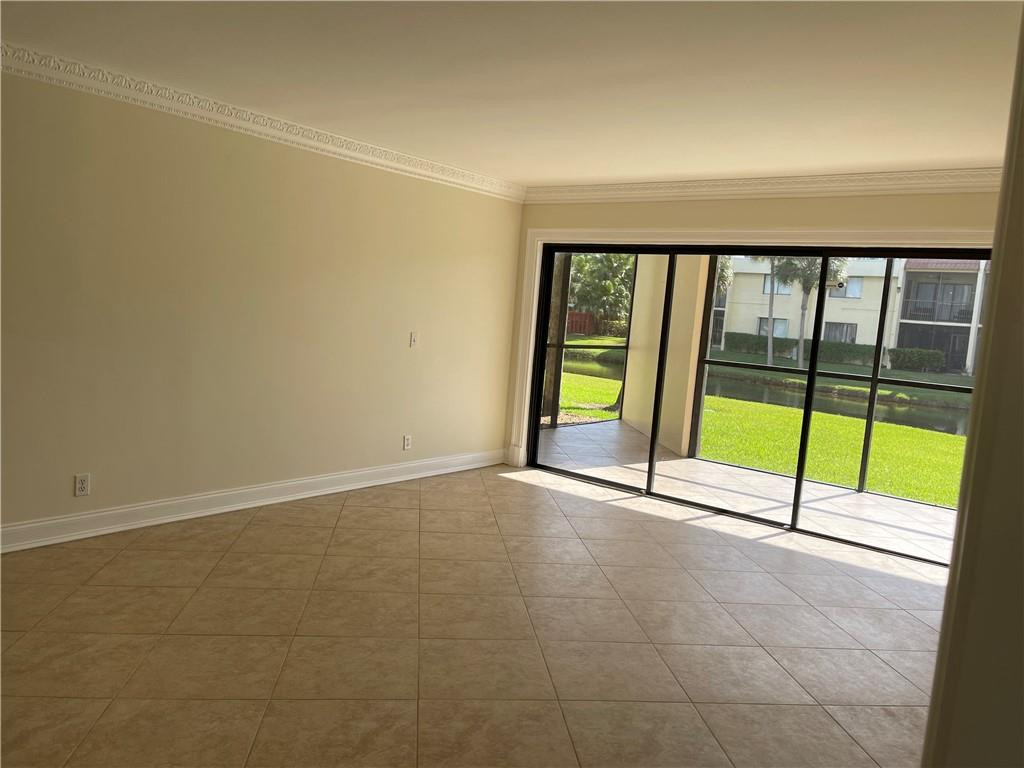 491 Racquet Club Road, Unit 109 Weston, FL 33326 - Photo 9 of 39 a view of an empty room and window