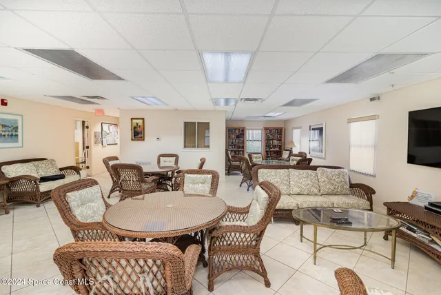 a view of a swimming pool with a lounge chair