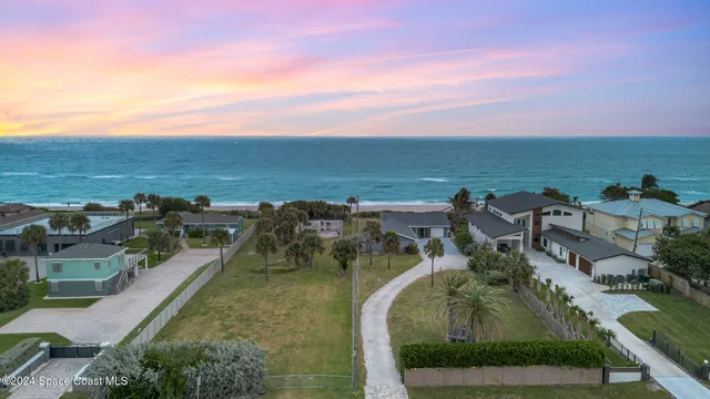 an aerial view of a house with outdoor space lake view and mountain view