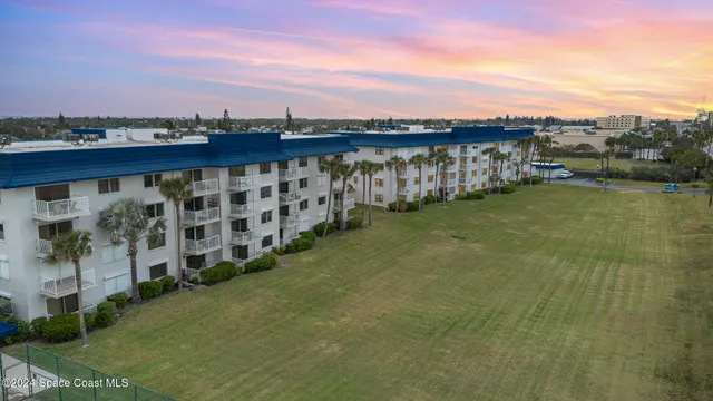 an aerial view of a building with outdoor space