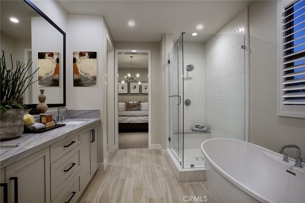 214 Maricopa Irvine, CA 92618 - Photo 4 of 9 a bathroom with a tub a sink and mirror