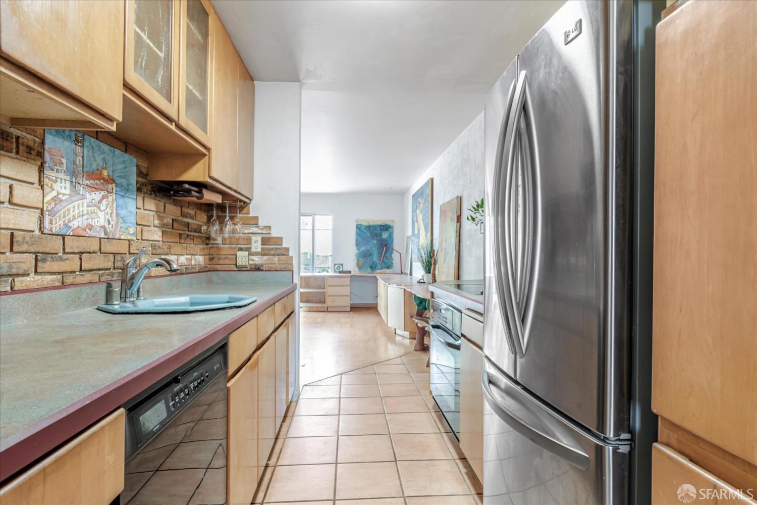 20 Inca Lane, Unit 2 San Francisco, CA 94115 - Photo 11 of 36 a kitchen with stainless steel appliances granite countertop a refrigerator a sink and a stove