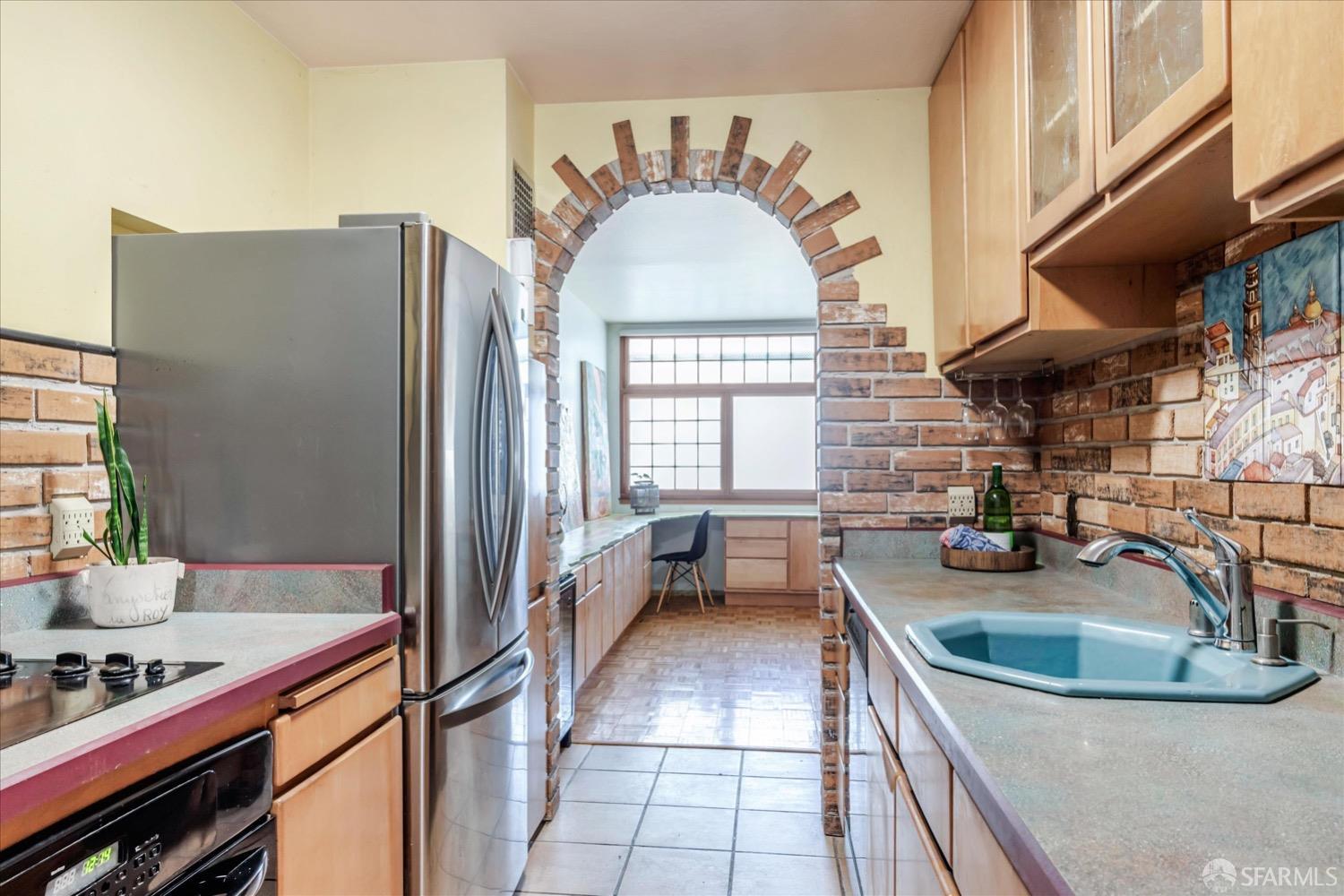 20 Inca Lane, Unit 2 San Francisco, CA 94115 - Photo 14 of 36 a kitchen with stainless steel appliances granite countertop a sink dishwasher stove and refrigerator