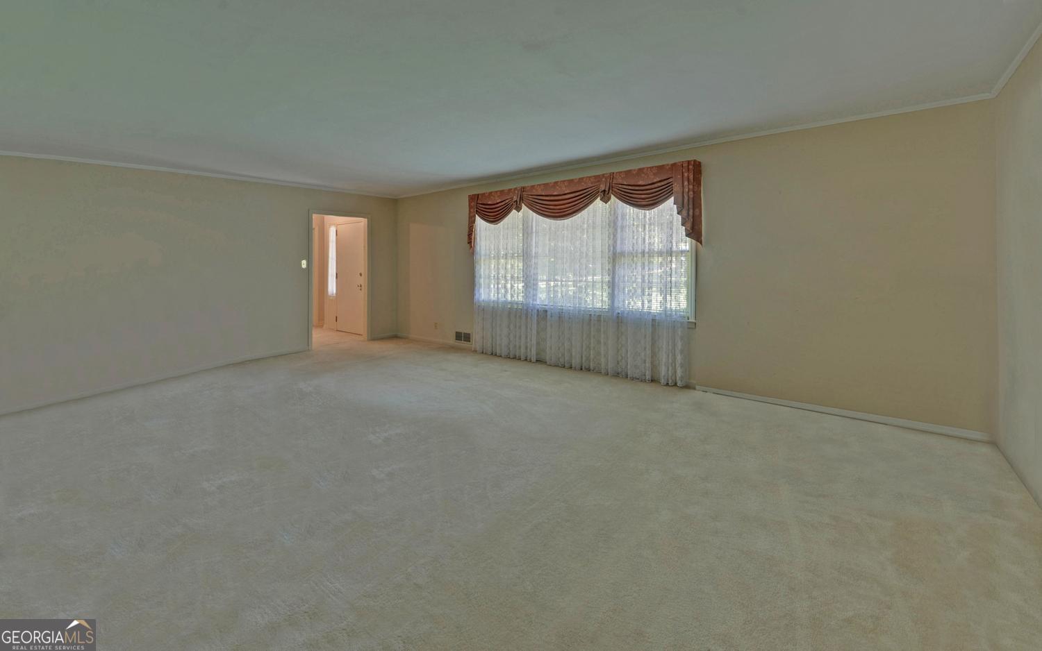 400 Harris Street Toccoa, GA 30577 - Photo 5 of 49 a view of an empty room with a window