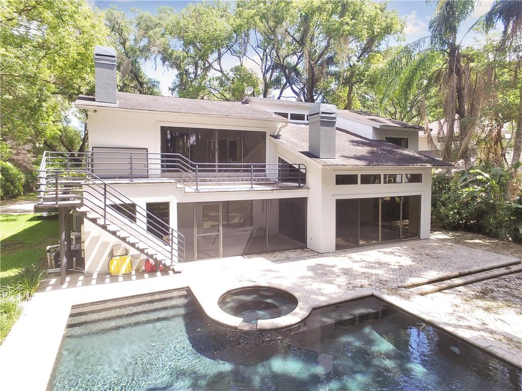19521 Deer Lake Road Lutz, FL 33548 - Photo 1 of 1 BACK EXTERIOR HIGHLIGHTS MASTER BALCONY AND POOL/SPA