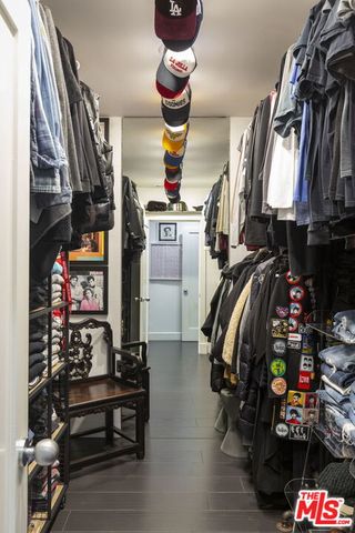 a view of hallway with wooden floor