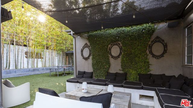 a wooden bench sitting in front of a building