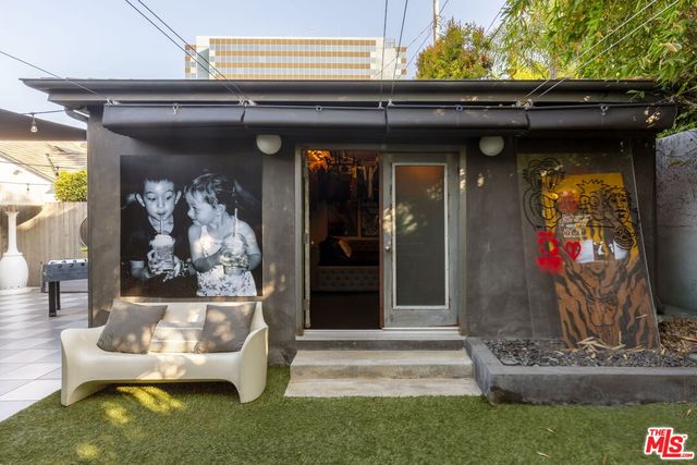 a bed room with a bed and a night stand