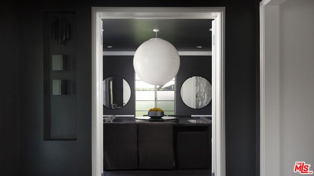 a bathroom with a mirror and a sink