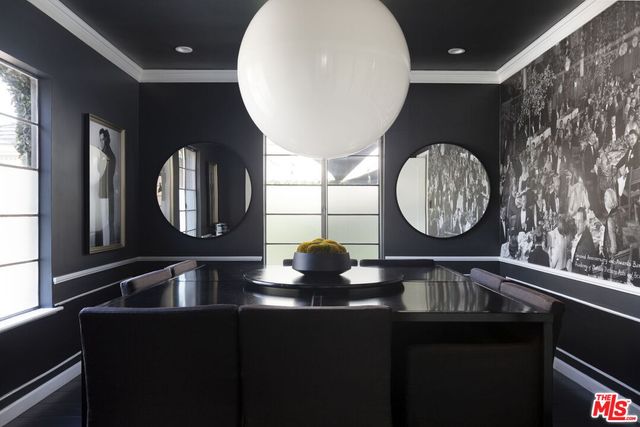 a kitchen with a sink and a mirror