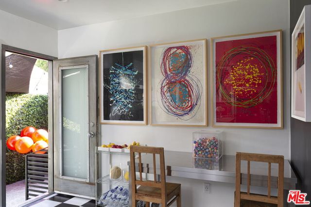 a view of a tables and chairs in patio