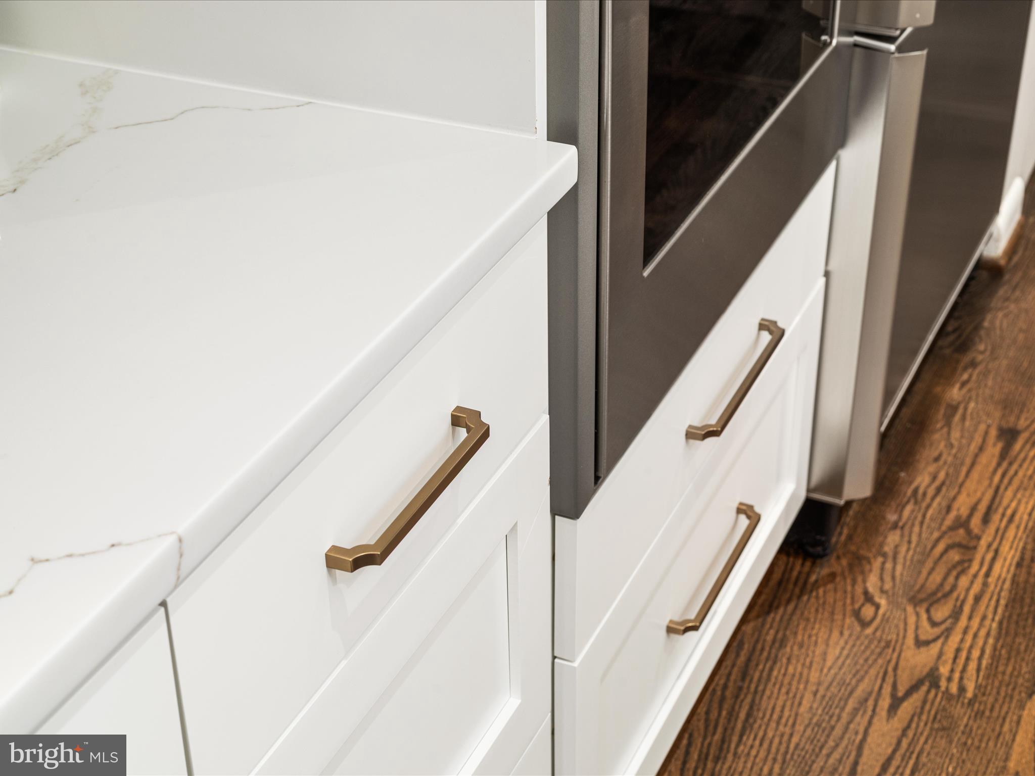 1303 Wedgewood Manor Way Reston, VA 20194 - Photo 32 of 57 White shaker style cabinetry with gold hardware