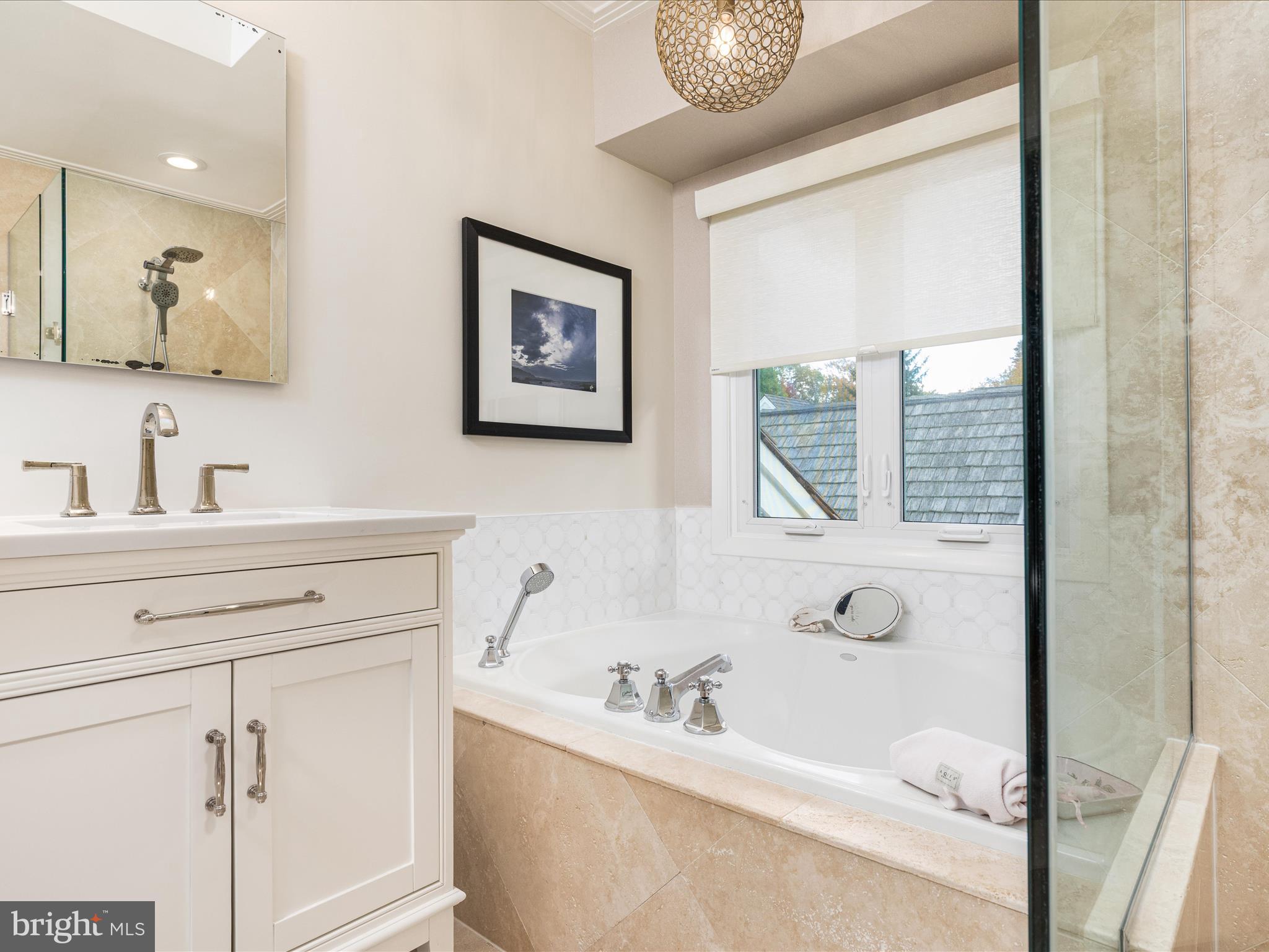 1303 Wedgewood Manor Way Reston, VA 20194 - Photo 40 of 57 Primary bath soaking tub and new vanity