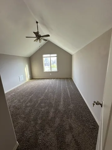 a view of empty room with windows