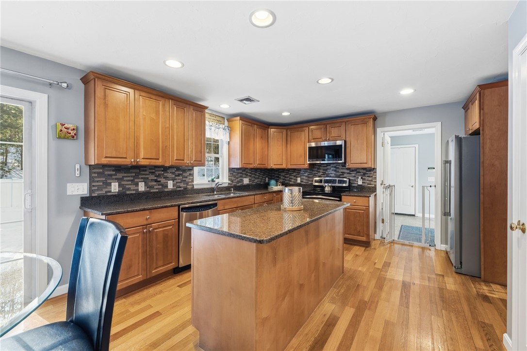 264 Round Top Road Burrillville, RI 02830 - Photo 11 of 49 New stainless steel appliances, tile backsplash, granite counter tops