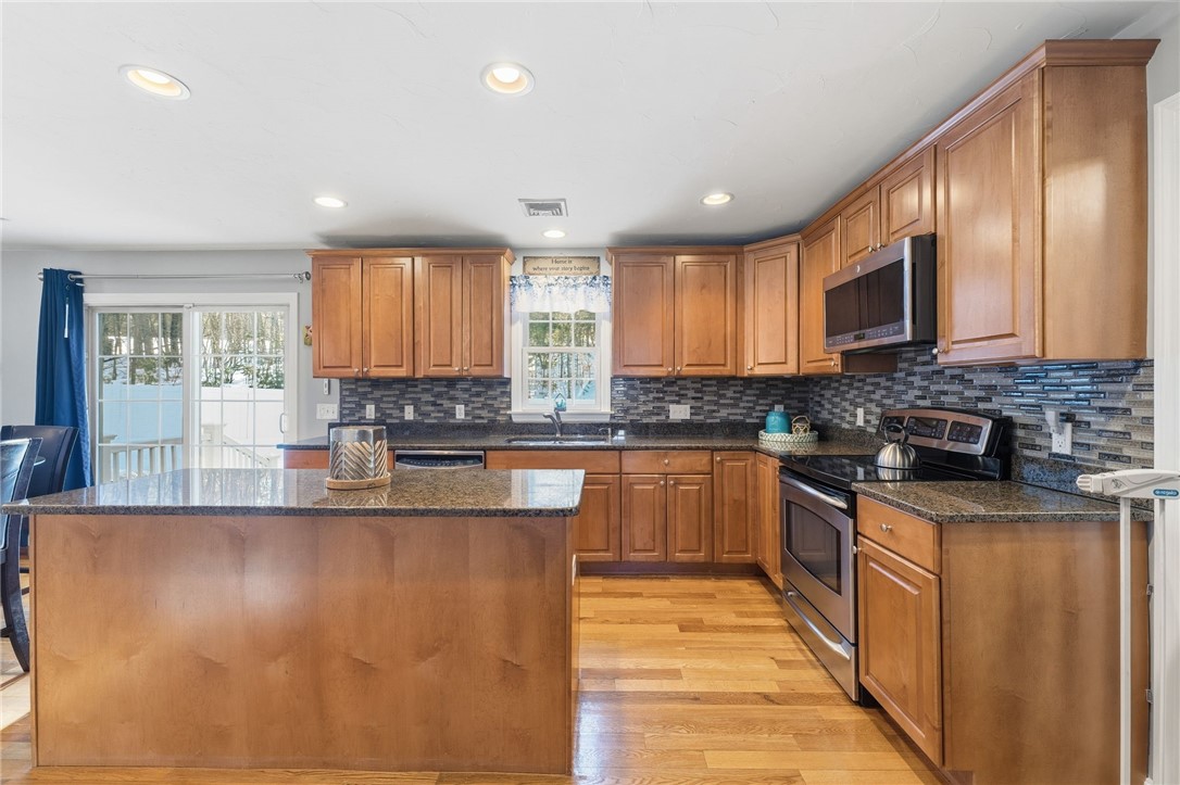 264 Round Top Road Burrillville, RI 02830 - Photo 13 of 49 New stainless steel appliances, tile backsplash, granite counter tops