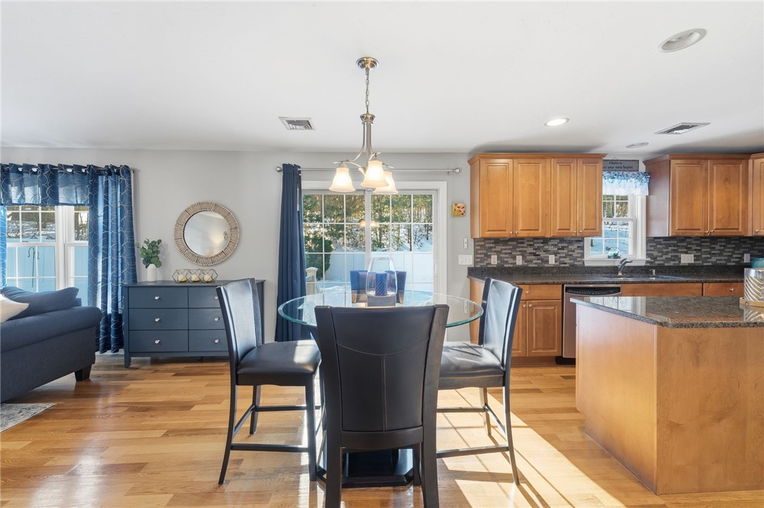 264 Round Top Road Burrillville, RI 02830 - Photo 15 of 49 sunny dining area between the kitchen and living space