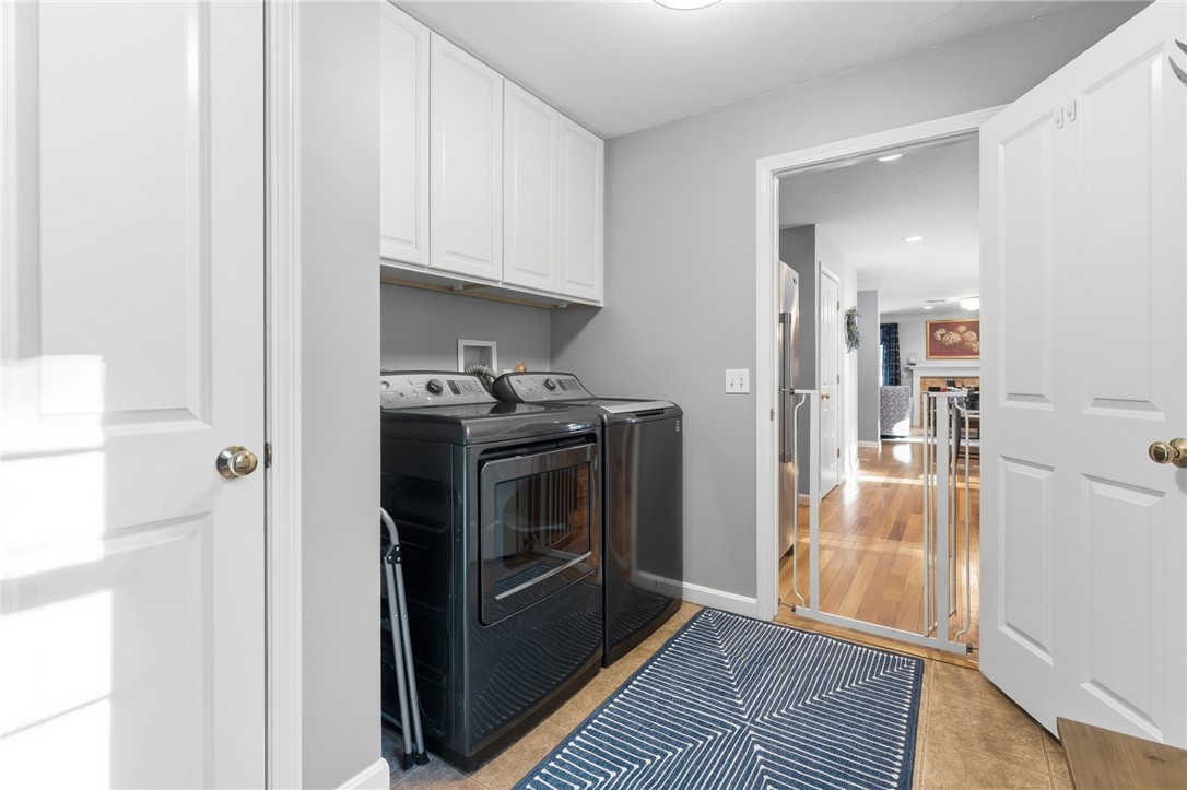264 Round Top Road Burrillville, RI 02830 - Photo 16 of 49 laundry room located on the first floor, new cabinets installed over the washer and dryer