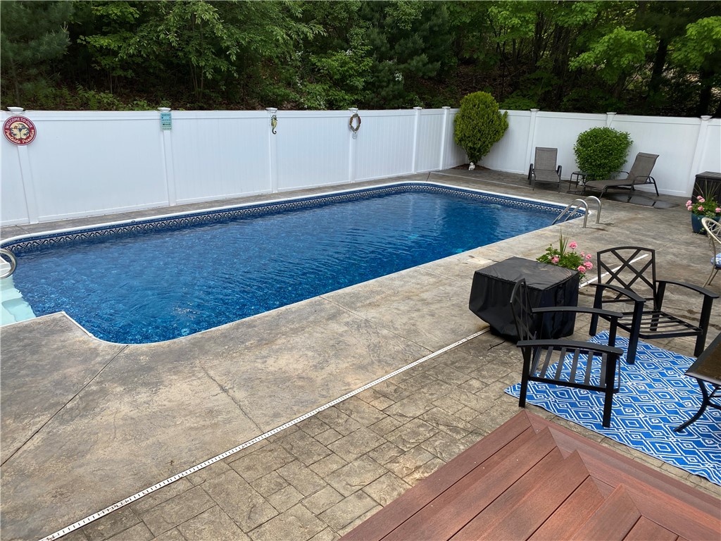 264 Round Top Road Burrillville, RI 02830 - Photo 43 of 49 pool with patio and new vinyl deck, and vinyl fencing