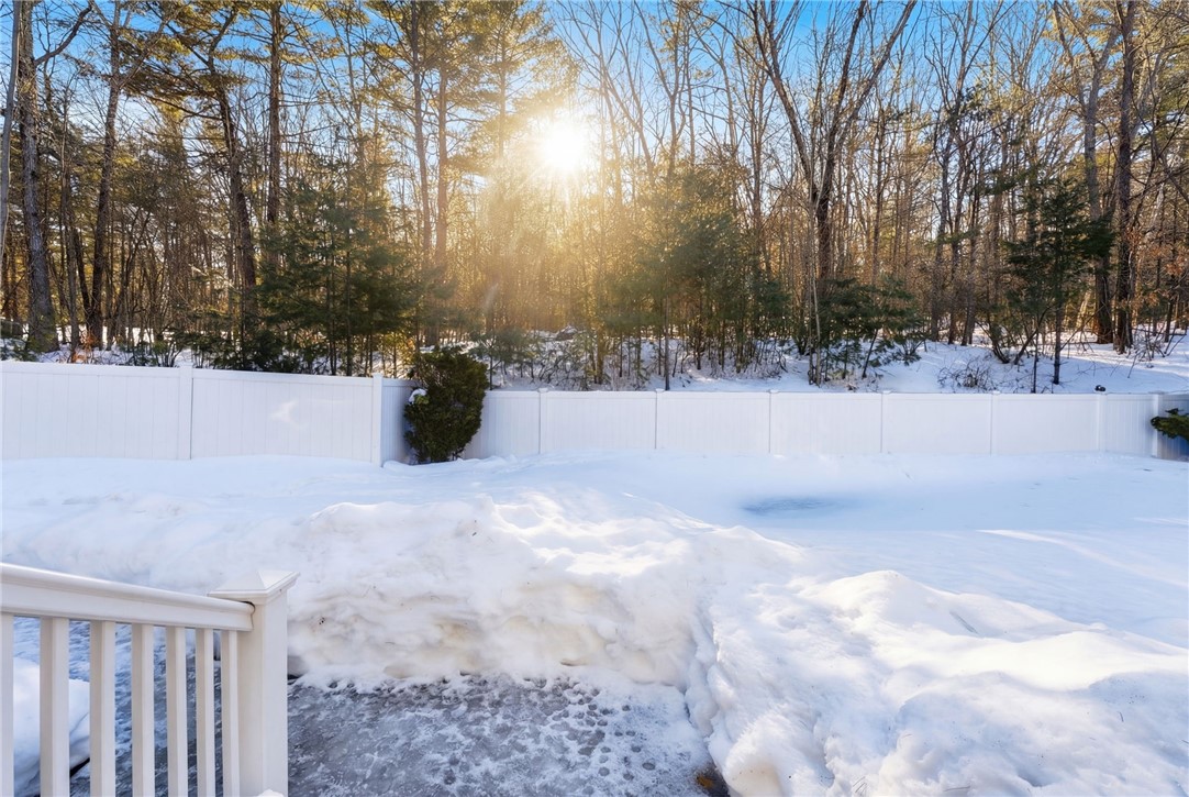 264 Round Top Road Burrillville, RI 02830 - Photo 47 of 49 New vinyl deck leading out to fully fenced heated in ground pool with new liner, stamped concrete pool apron, and retractable awning. More photos to come as snow melts.