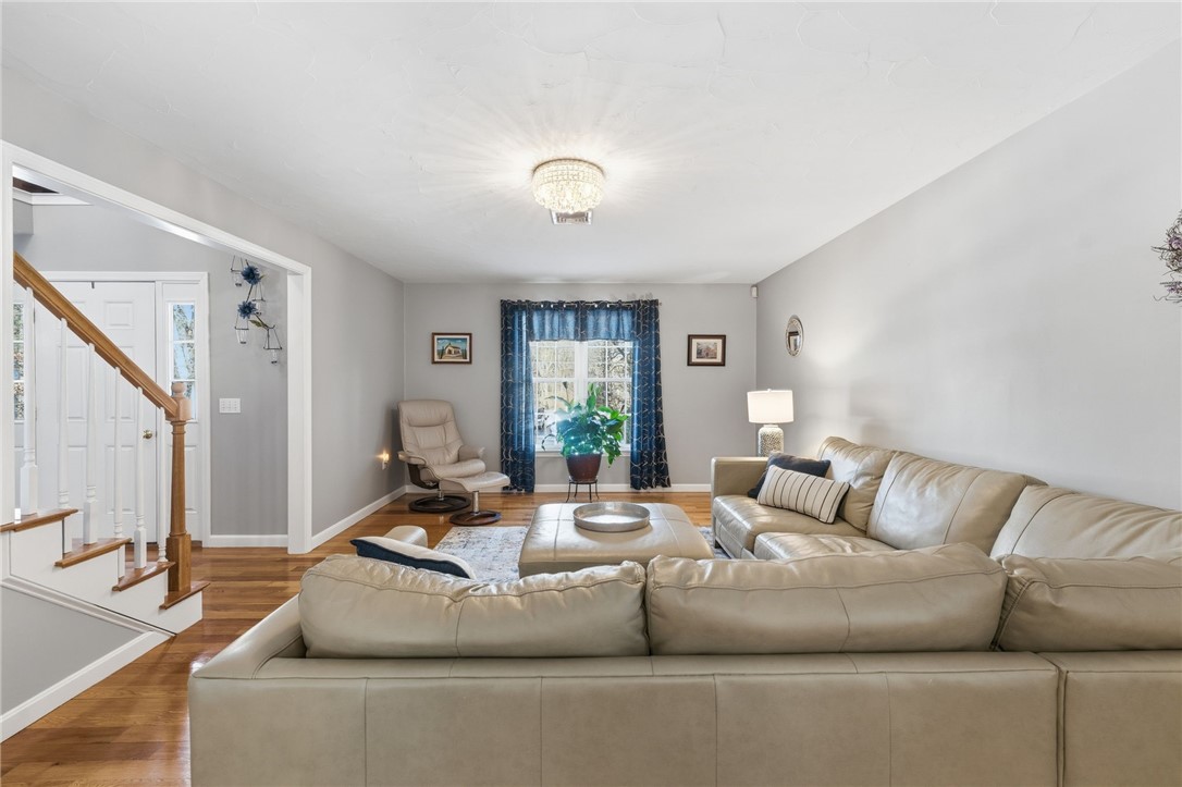 264 Round Top Road Burrillville, RI 02830 - Photo 5 of 49 front to back living/family room with gleaming hardwood floors