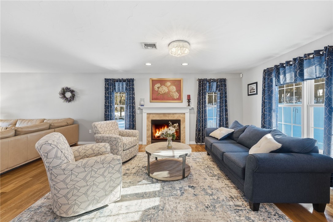 264 Round Top Road Burrillville, RI 02830 - Photo 8 of 49 cozy formal sitting room overlooking the in-ground pool with gas fireplace.