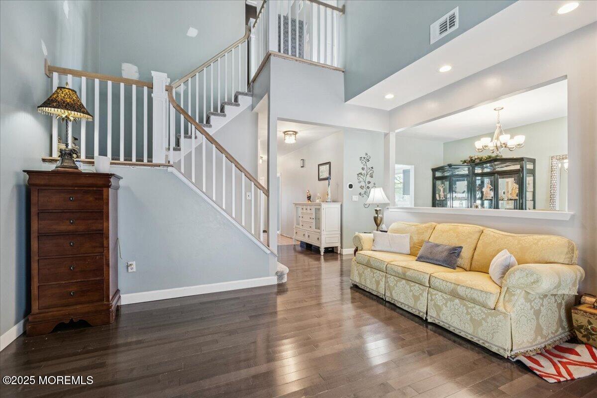 16 Longbrook Lane, Unit 16 Freehold, NJ 07728 - Photo 14 of 28 a living room with furniture and wooden floor