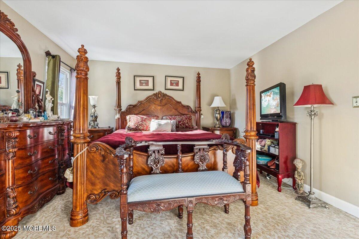 16 Longbrook Lane, Unit 16 Freehold, NJ 07728 - Photo 18 of 28 a living room with furniture and wooden floor