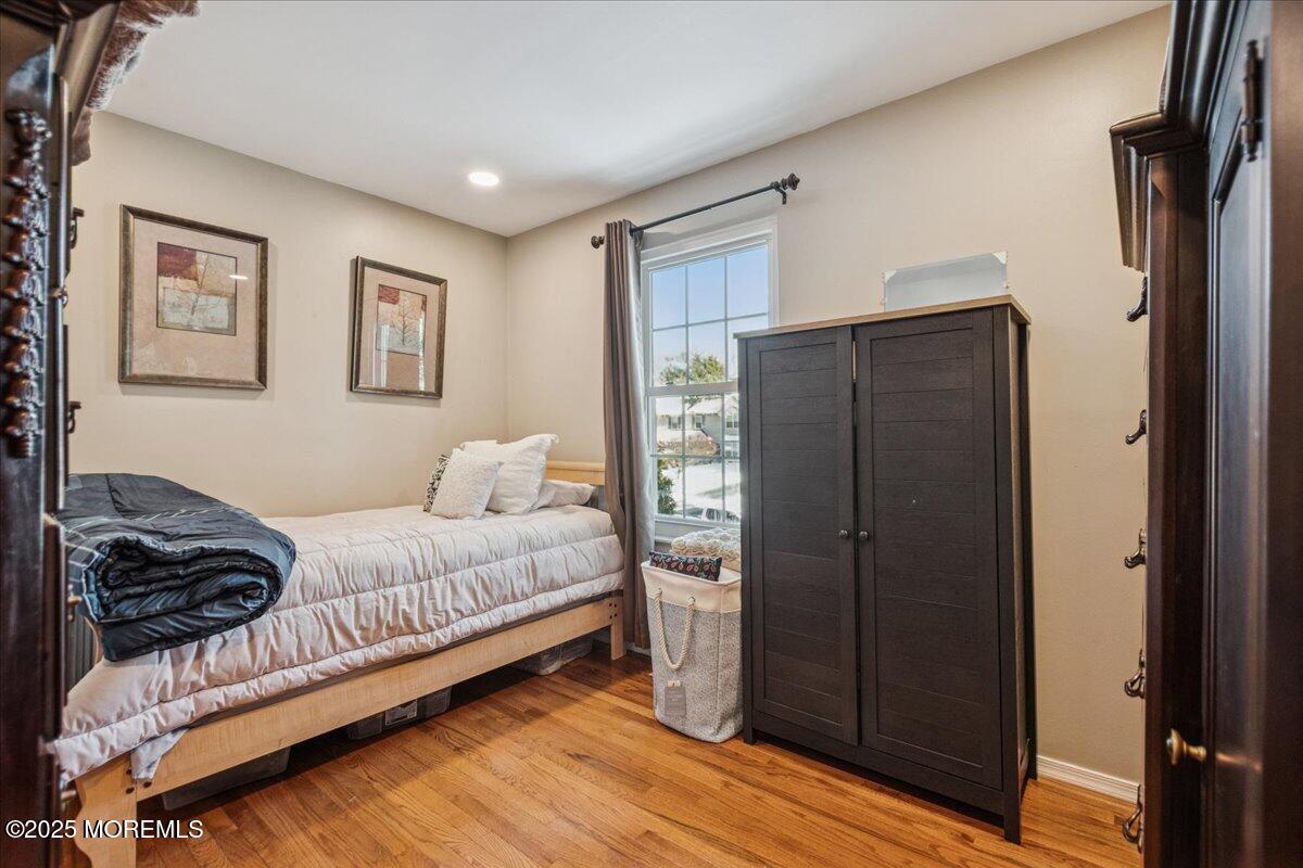 16 Longbrook Lane, Unit 16 Freehold, NJ 07728 - Photo 20 of 28 a bedroom with a bed window and a walk in closet