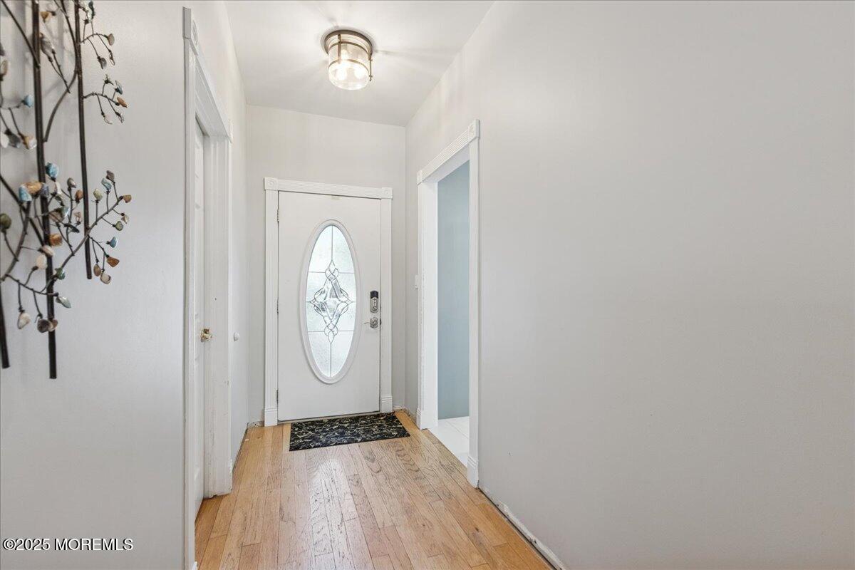 16 Longbrook Lane, Unit 16 Freehold, NJ 07728 - Photo 2 of 28 a view of a hallway with wooden floor