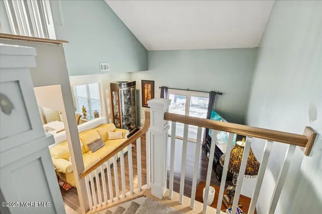 a view of an entryway with wooden floor