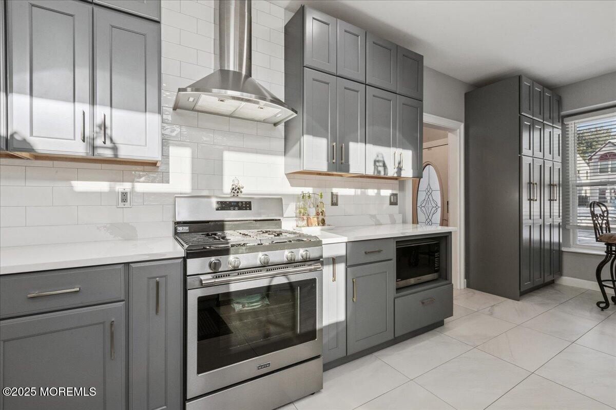 16 Longbrook Lane, Unit 16 Freehold, NJ 07728 - Photo 8 of 28 a kitchen with cabinets a stove and a sink