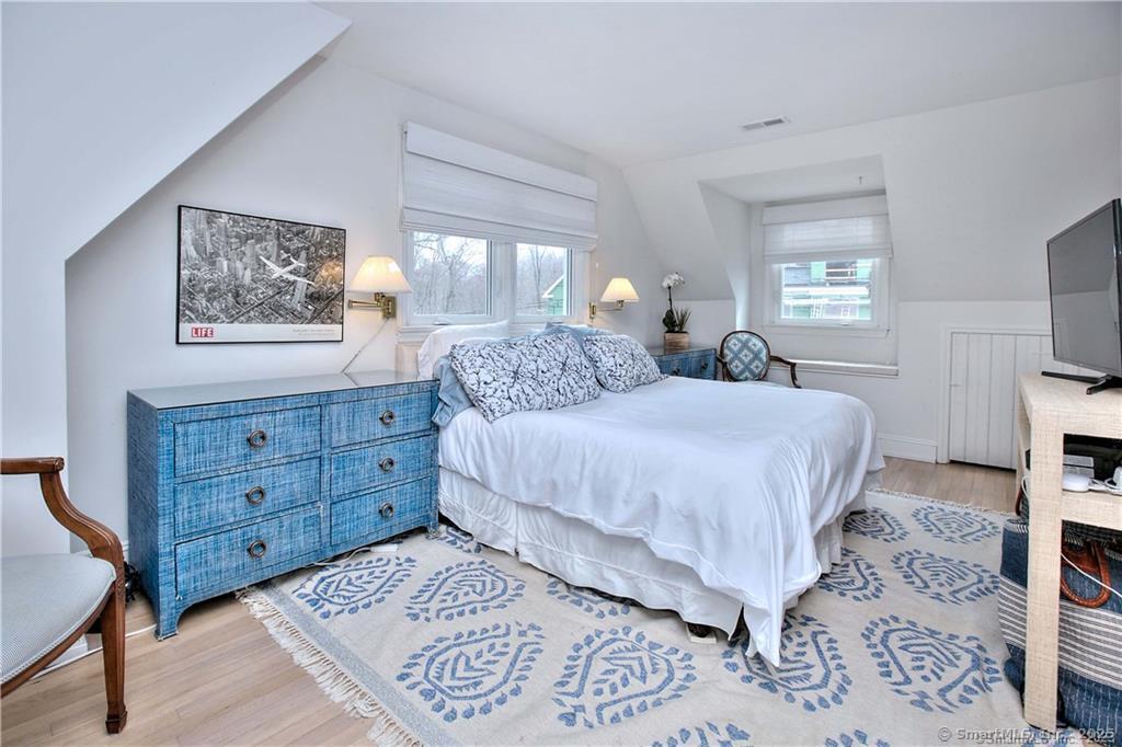 28 Narrow Rocks Road Westport, CT 06880 - Photo 22 of 35 a bedroom with a bed and a window