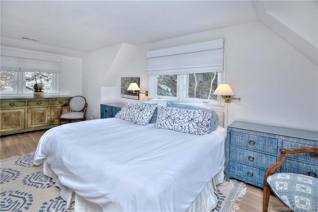 28 Narrow Rocks Road Westport, CT 06880 - Photo 23 of 35 a bedroom with a bed and wooden floor
