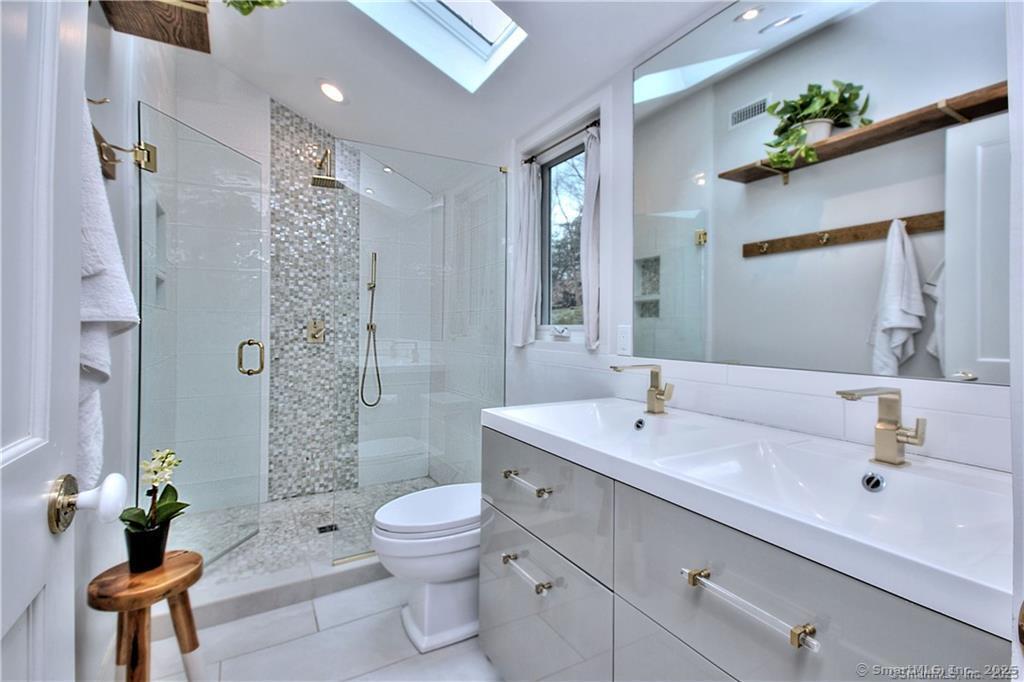 28 Narrow Rocks Road Westport, CT 06880 - Photo 24 of 35 a bathroom with a sink a toilet and shower