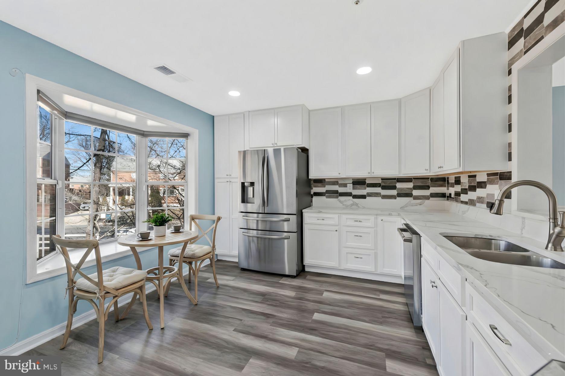 4675 Red Hawk Terrace Bladensburg, MD 20710 - Photo 2 of 14 a kitchen with a refrigerator and wooden cabinets