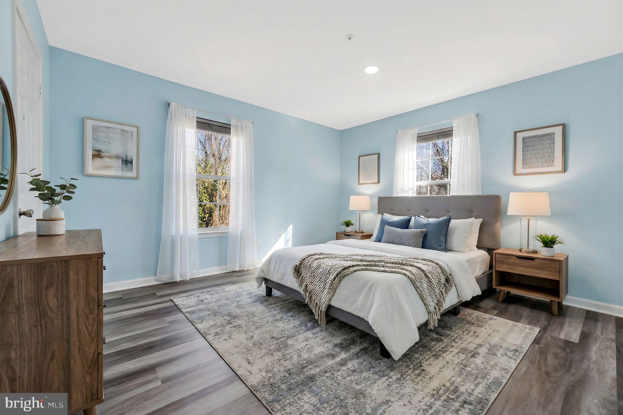 4675 Red Hawk Terrace Bladensburg, MD 20710 - Photo 8 of 14 a spacious bedroom with a bed and wooden floor