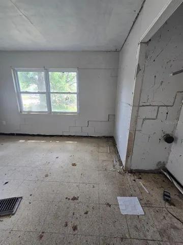 a view of an house with backyard space and balcony