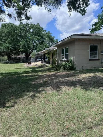 a view of outdoor space with deck and tree
