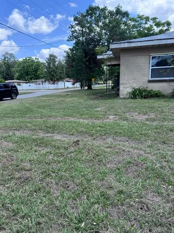 a view of backyard with green space