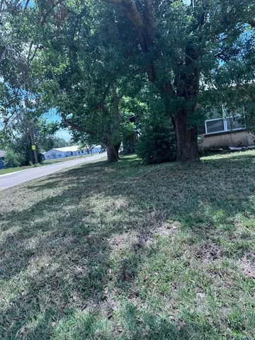 a view of outdoor space with deck and yard