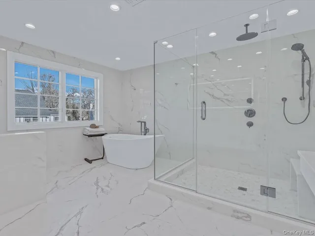 a bathroom with a sink vanity and mirror