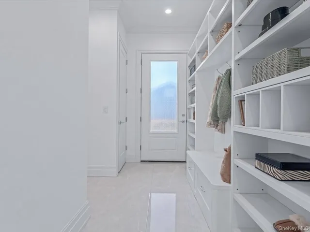 a bedroom with a bed and a night stand