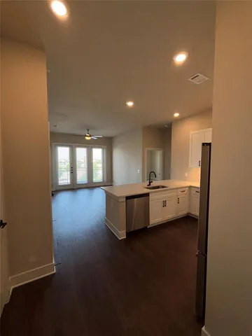a view of a room with window and wooden floor