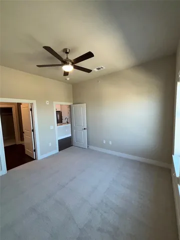 a view of a livingroom with a ceiling fan