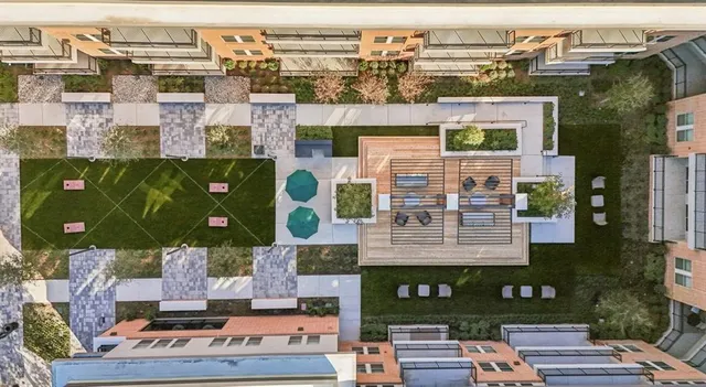 an aerial view of residential building and parking space